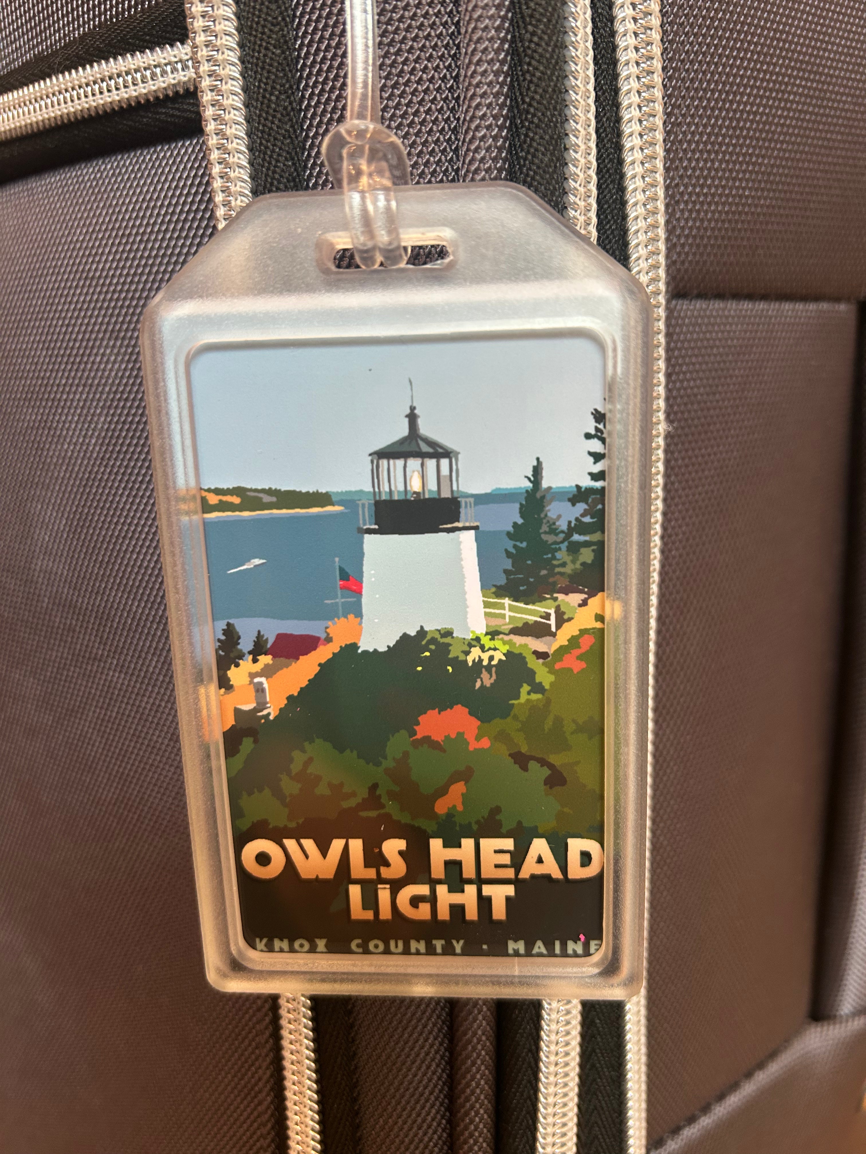 Above Owls Head Lighthouse Luggage Tag